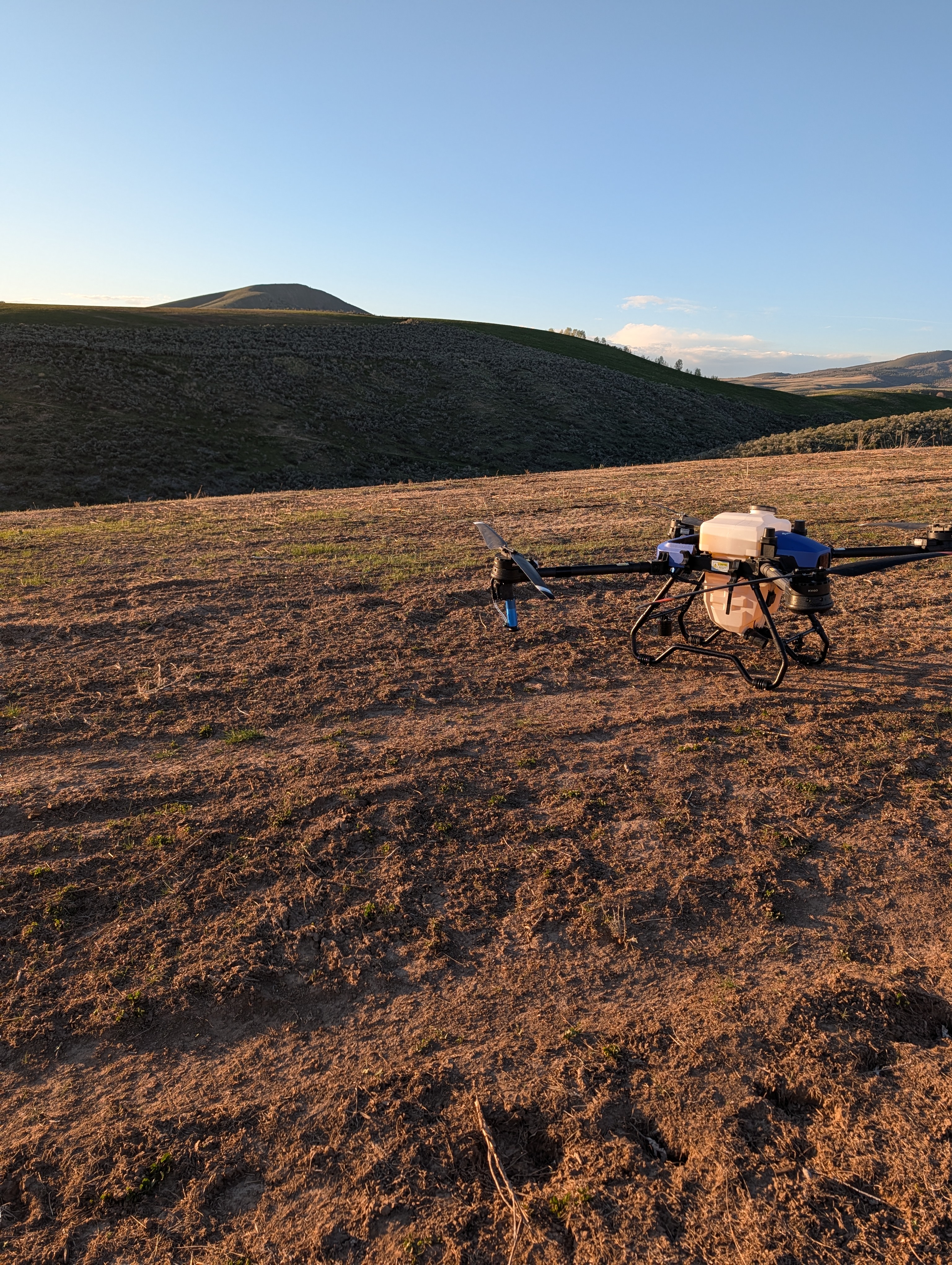 EAS Drones agricultural drone in open field at golden hour